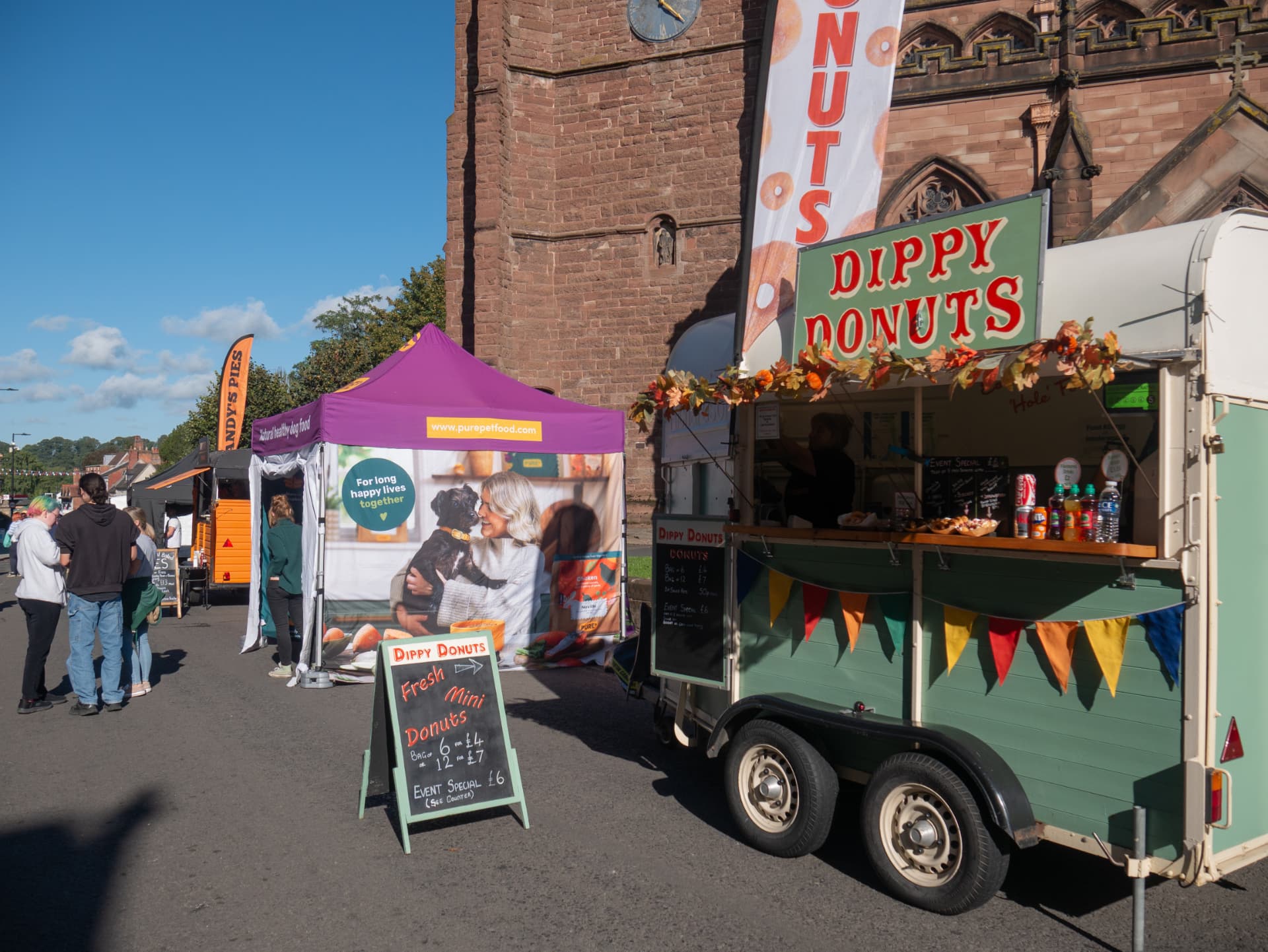 Dippy Donuts trailer beside the church at Newport Food Frenzy 2026