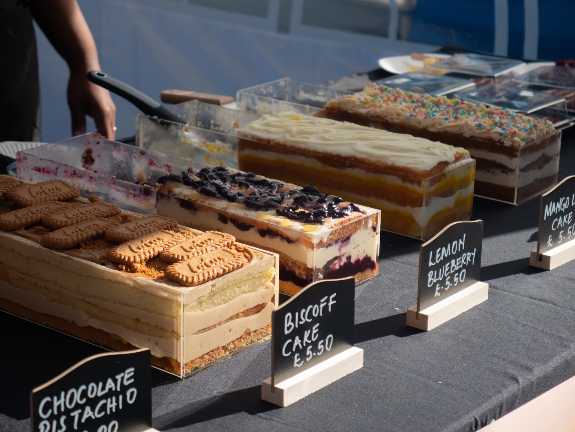 Layered cakes on display at a food stall at Newport Food Frenzy 2026